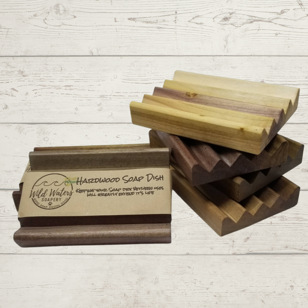 a stack of multicolored wooden soap dishes