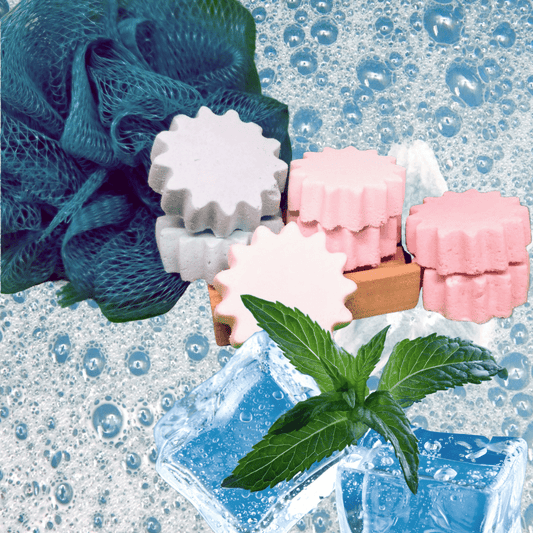 a stack of shower steamers, bubbles, ice and a sprig of mint